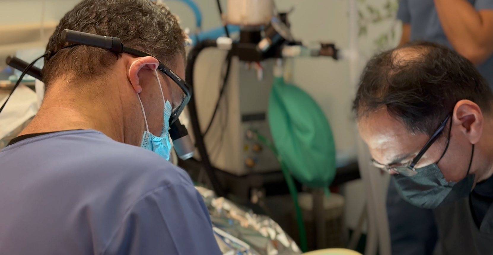 Dr. Sam Morhaim placing dental implants on senior patient at Tribeca Dental Studio NYC